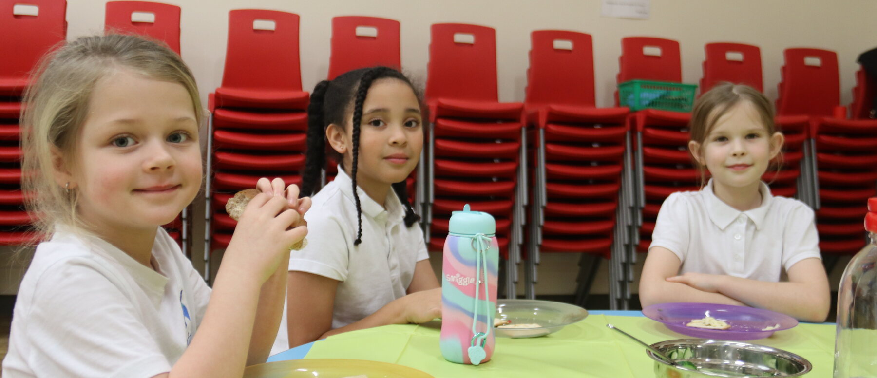 Children having a snack together at a uKids after-school club