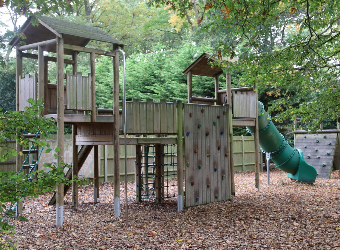 Adventure playground with climbing frame and slide