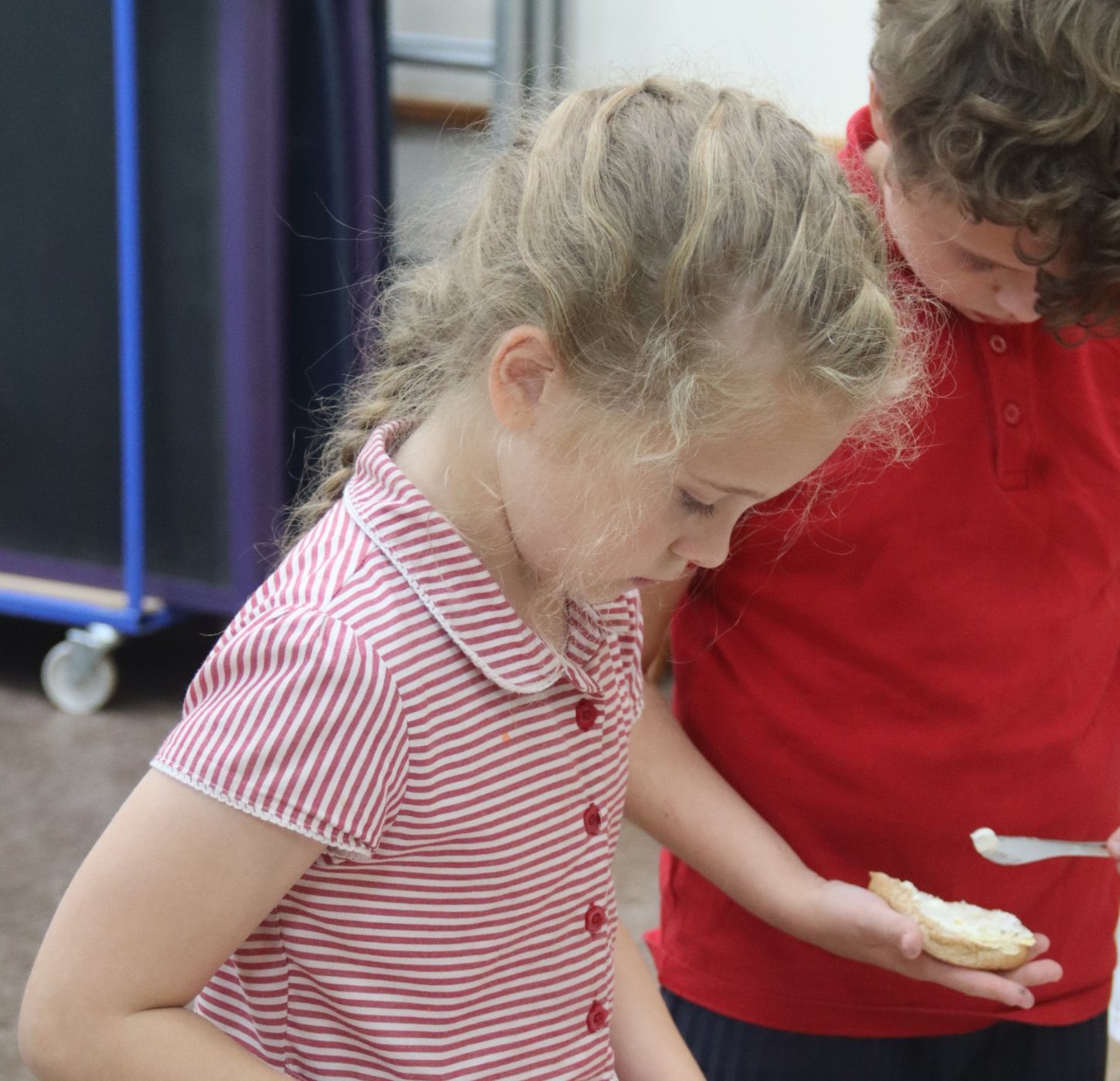 Children making their own snack at uKids after-school club at Hampstead Norreys