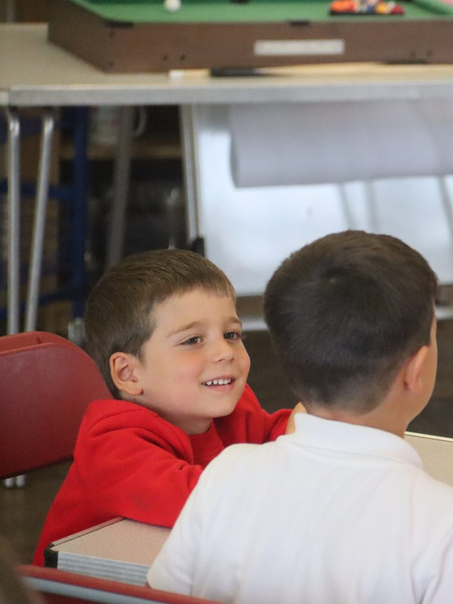 Children chatting at a table at uKids after-school club at The Ilsleys