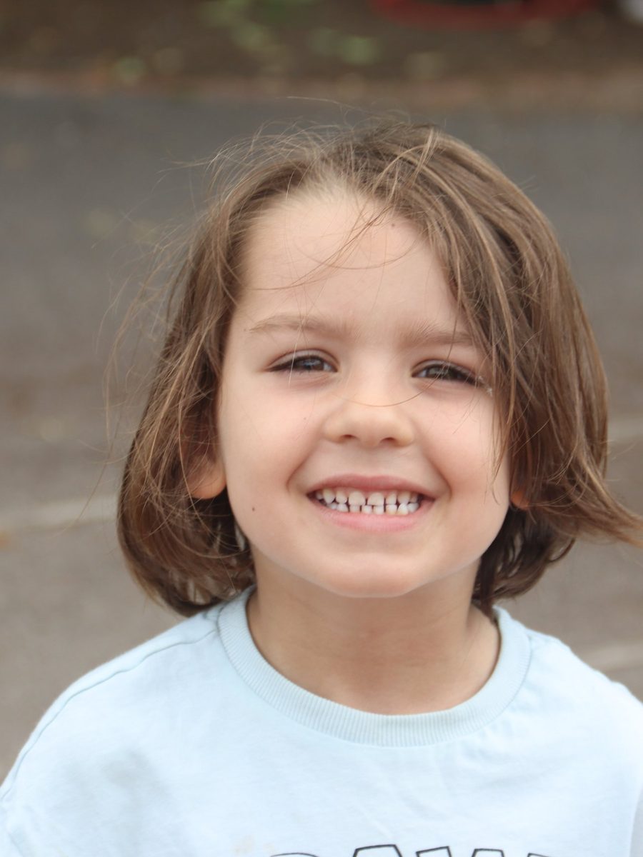 A smiling child at uKids club
