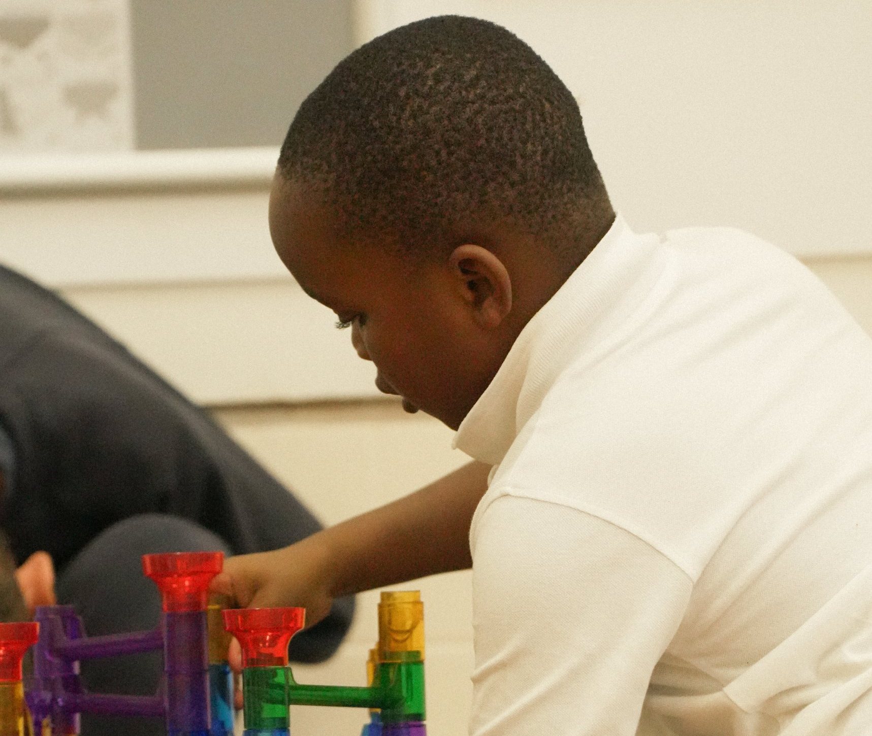A child building a marble run at uKids club at Shinfield St Mary&rsquo;s