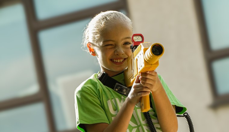A child taking part in Woodland Warriors laser combat at Cheam